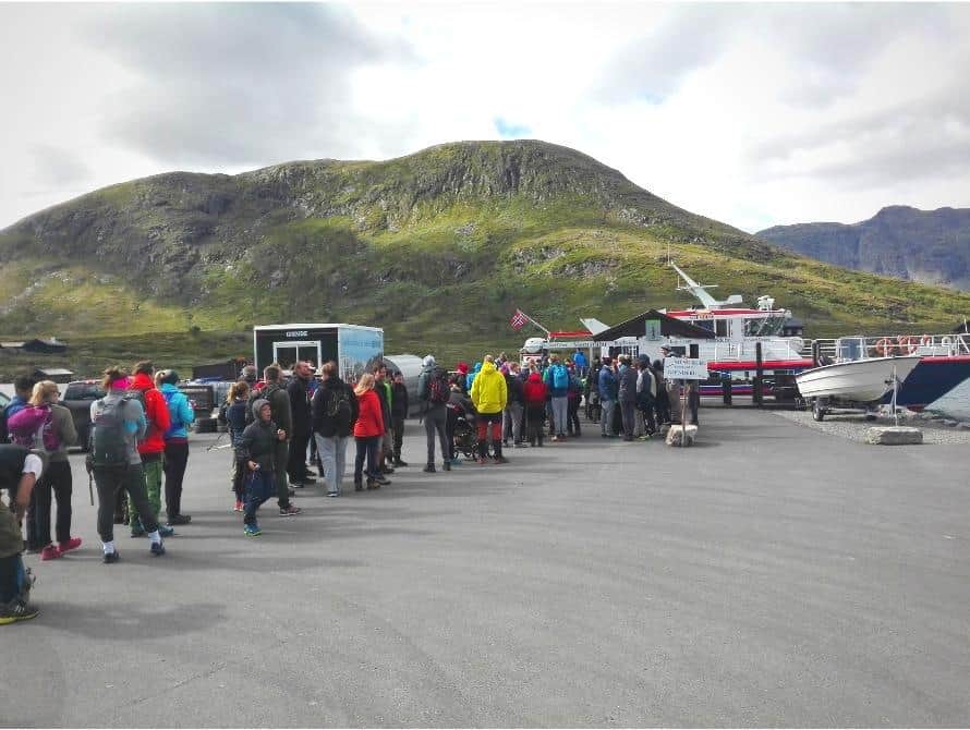 tourists waiting for ferry in Gjendesheim Besseggen
